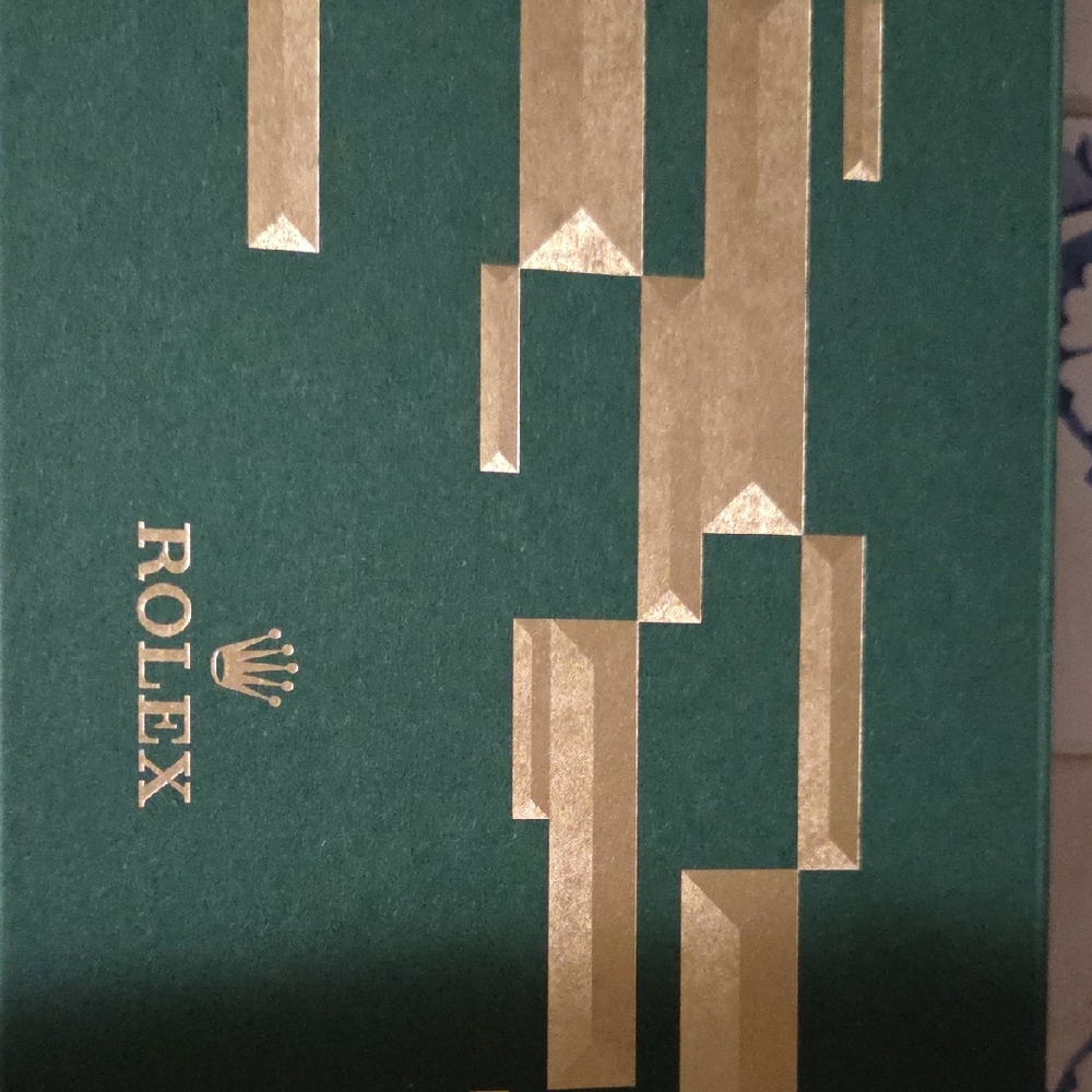 Rolex Green Box with Gold Detailing